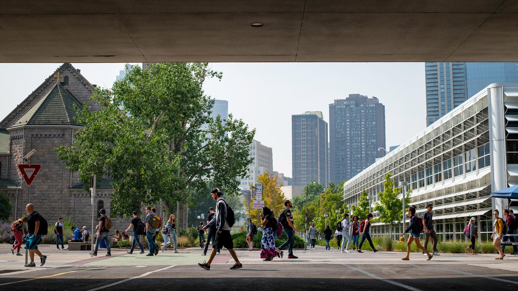 students walking on campus, bridge featured